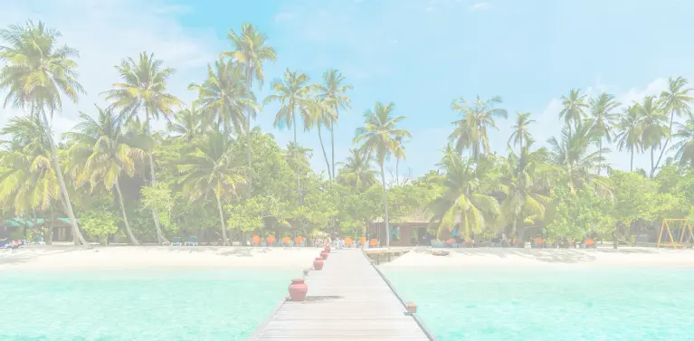 A wooden dock leading to a beach
